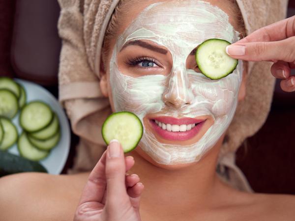 Smiling girl with cosmetic mask