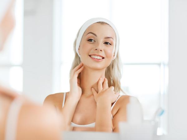 Woman applying skincare